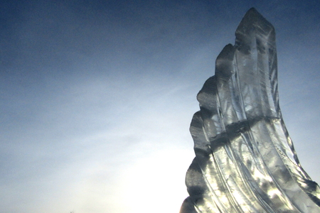 Ice wing on sky background and sun raysの写真素材