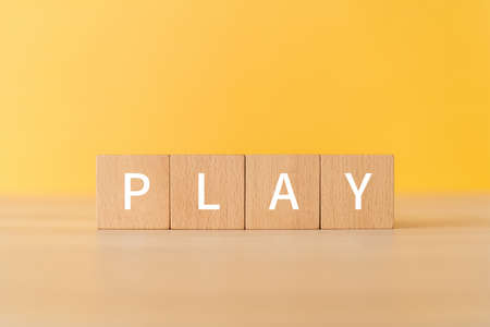 Wooden blocks with "PLAY" text of concept.の写真素材