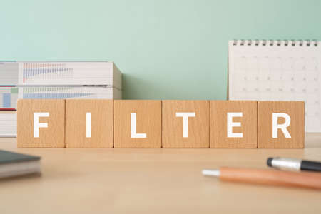 FILTER word made with wood building blocks on office desk.の写真素材