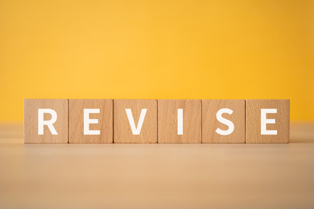 Wooden blocks with "REVISE" text of concept.の写真素材