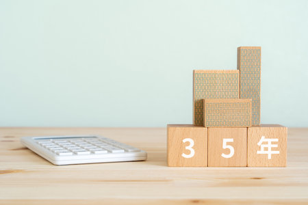 Wooden blocks with number 35 and calculator on wooden table with copy space