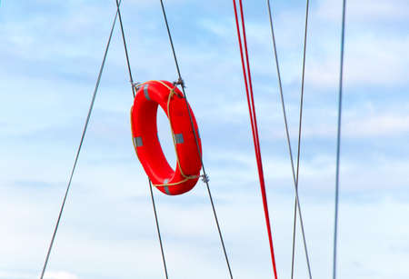 Hanging lifebuoy. Lifebuoy and blue sky.