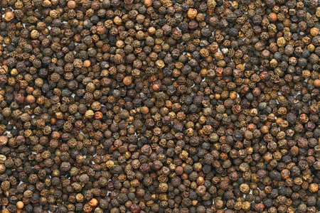 Black peppercorn background. Black pepper background.