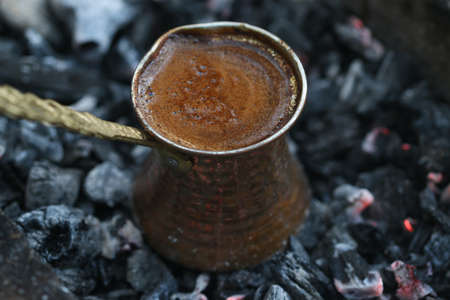 Ember Turkish coffee. Roasted Turkish coffee. Traditional Nubian coffee making. Coffee turk on the coal.の写真素材