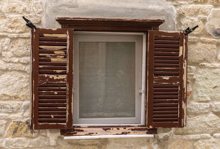 Window.old barred windows ornamented with metal lattice.の写真素材