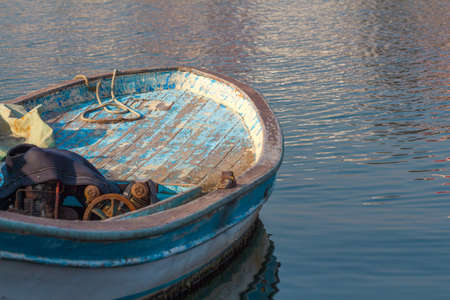 Old fishing boat. Old wooden blue boat.の写真素材