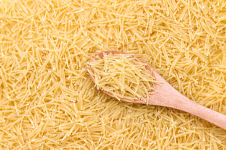 Raw vermicelli pasta background. Vermicelli Pasta texture background. Traditional Italian food.の写真素材