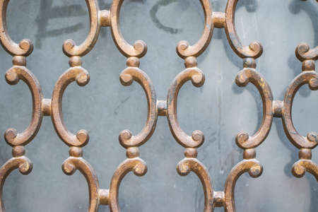 Fragment of ornamental wrought iron window grill.