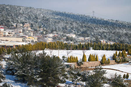 Houses with roofs snow. Winter mountain landscape.の写真素材