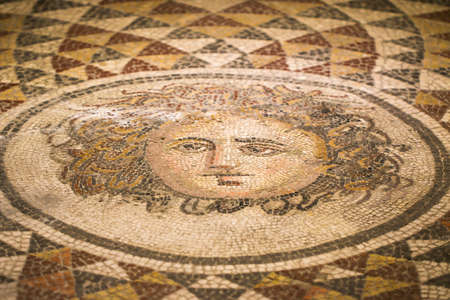 The colorful mosaic with abstract pattern and the head of mythic Medusa Gorgon.の写真素材
