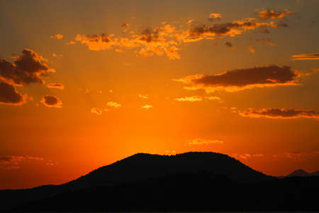 Sunset sky with evening sky clouds lit by bright sunlight.の写真素材