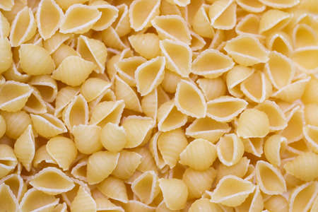 The full background of dry uncooked macaroni pasteの写真素材