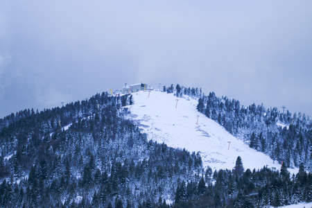 Uludag is the ancient Mysian Olympus and Bithynian Olympus, a mountain in Bursa Province, Turkey. Ski lifts durings bright winter day.の写真素材