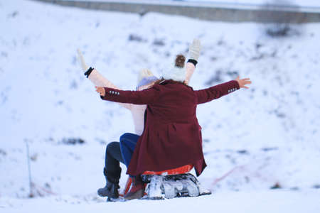 The girls enjoy a sleigh ride. Outdoor fun for family Christmas vacation. Uludag is the ancient Mysian Olympus and Bithynian Olympus, a mountain in Bursa Province, Turkey.の写真素材