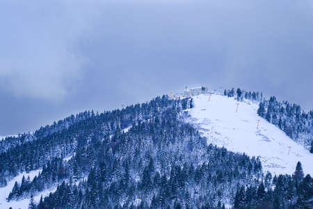 Uludag is the ancient Mysian Olympus and Bithynian Olympus, a mountain in Bursa Province, Turkey. Ski lifts durings bright winter day.の写真素材