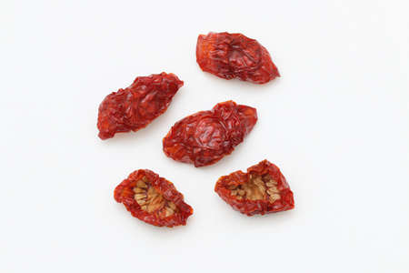 Sun dried cherry tomatoes isolated on white background.の写真素材