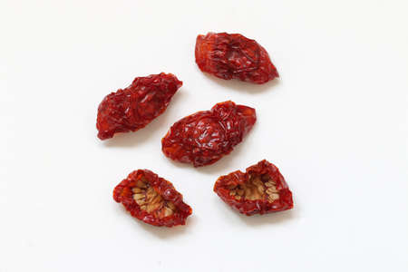 Sun dried cherry tomatoes isolated on white background.の写真素材