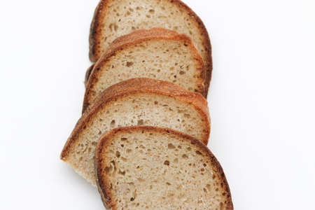 Sour yeast bread slices. Tradtional homemade bread on white background.