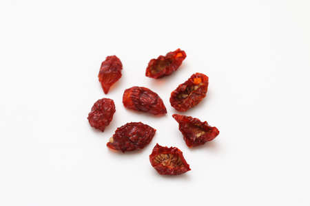Sun dried cherry tomatoes isolated on white background.の写真素材