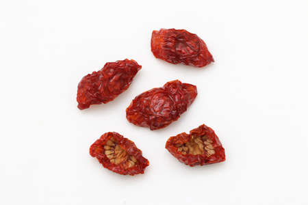 Sun dried cherry tomatoes isolated on white background.の写真素材