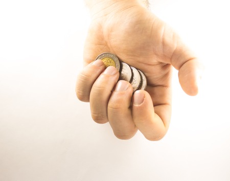 Hand holding coinsの写真素材