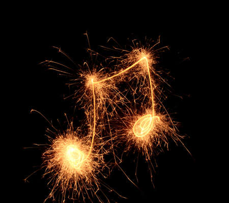 Sparklers notes isolated on black background. Music symbolの写真素材