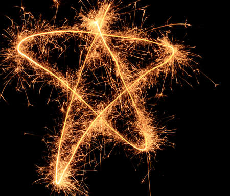 Sparkler  five-angle Christmas star on black backgroundの写真素材