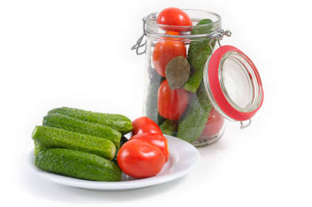 canning tomatoes and cucumbersの写真素材