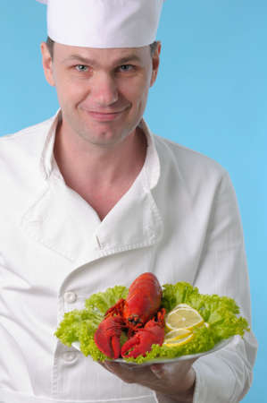 Chef with lobster plated woith lemonの写真素材