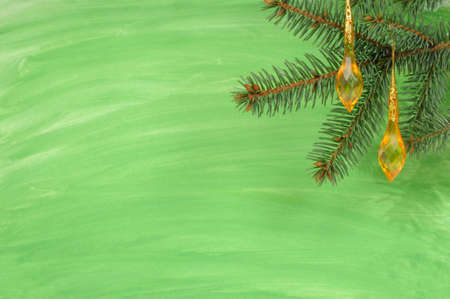 Green christmas background with fir and decorationsの写真素材
