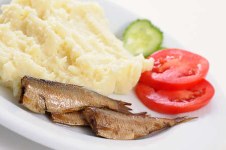 Smoked sardine with potato mash and vegetablesの写真素材