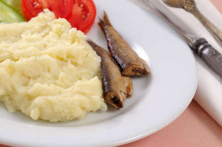 Smoked sardine with potato mash and vegetablesの写真素材