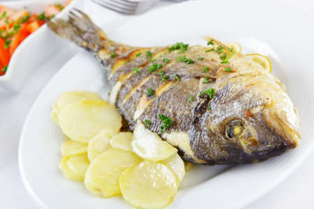 Roasted gilt-head sea bream with vegetables