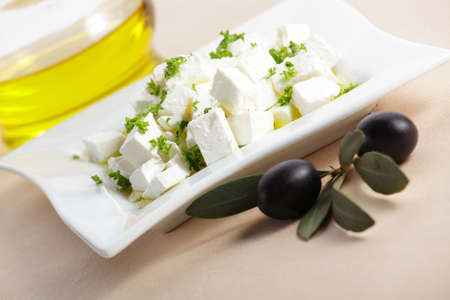 feta cheese with olive branchの写真素材