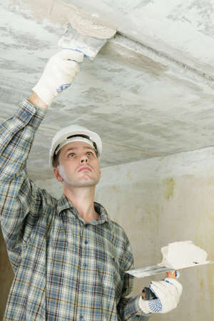 Contractor pargets the ceilingの写真素材