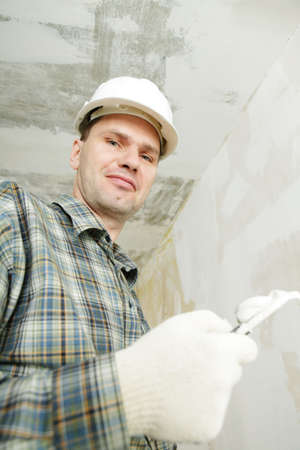 Contractor plasters the ceilingの写真素材