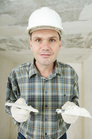 Contractor plasters the ceilingの写真素材