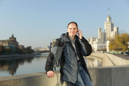 Tourist with backpack and mobile phone in Moscow, Russiaの写真素材