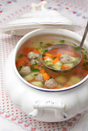 Vegetable soup with meatballs in a tureenの写真素材