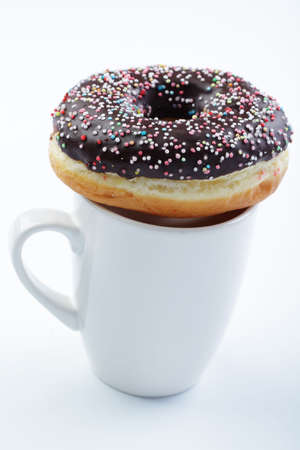 Donut on a cup of milkの写真素材