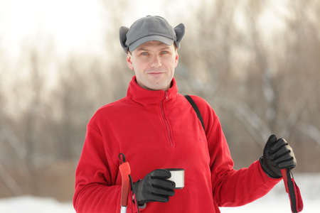 Cross-country skier drinking tea during a breakの写真素材
