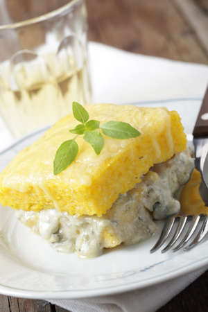 Polenta with blue cheese and basil leafの写真素材