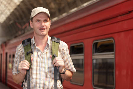 Tourist with backpack on the train stationの写真素材