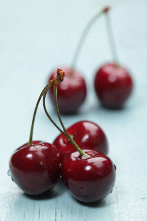 Ripe cherry closeup on a rustic deskの写真素材