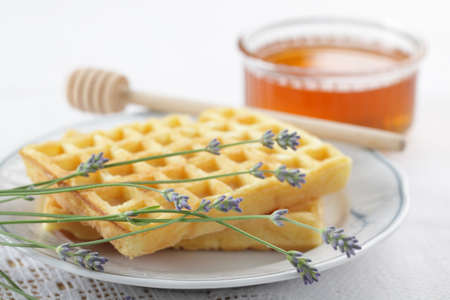 Belgian waffles, fresh honey, and a bunch of lavenderの写真素材
