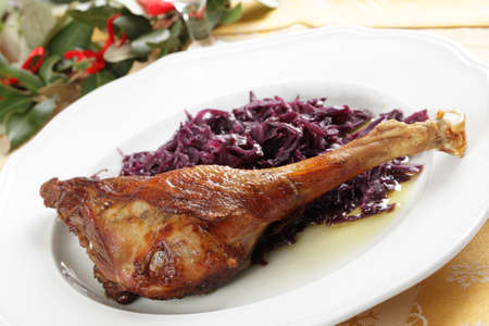Roasted goose leg with braised red cabbageの写真素材