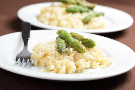 Risotto with asparagus on the white plateの写真素材