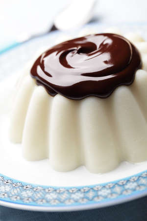 Blancmange whith chocolate on the plate closeupの写真素材