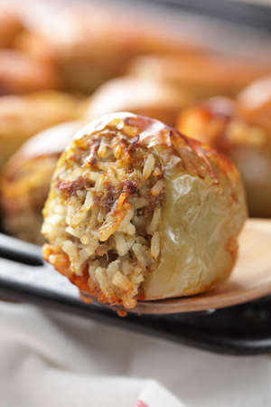 Stuffed pepper on the wooden spoon closeupの写真素材