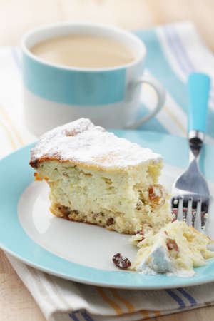 Cheesecake with raisins and hot chocolateの写真素材